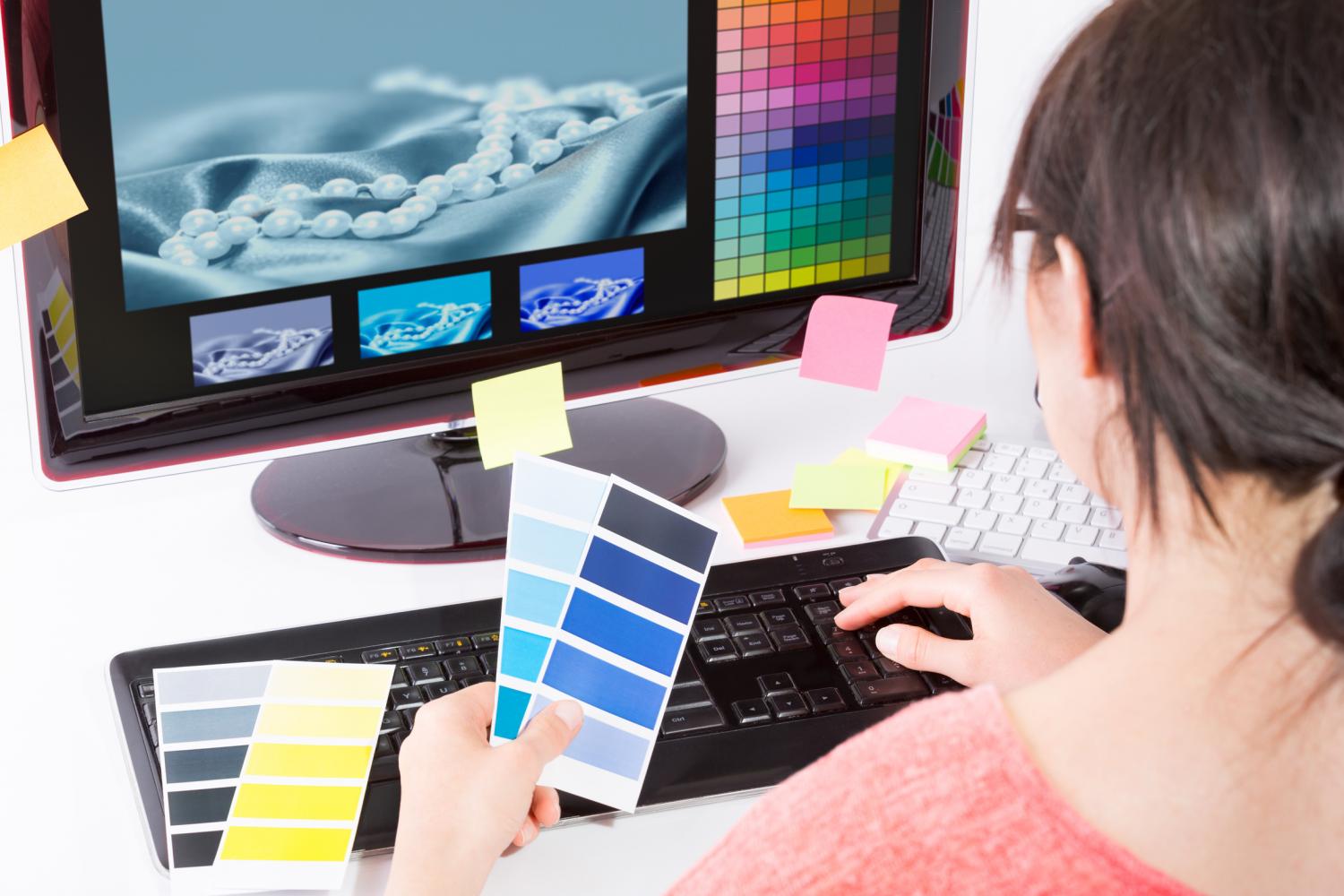 Photo of woman holding color samples
