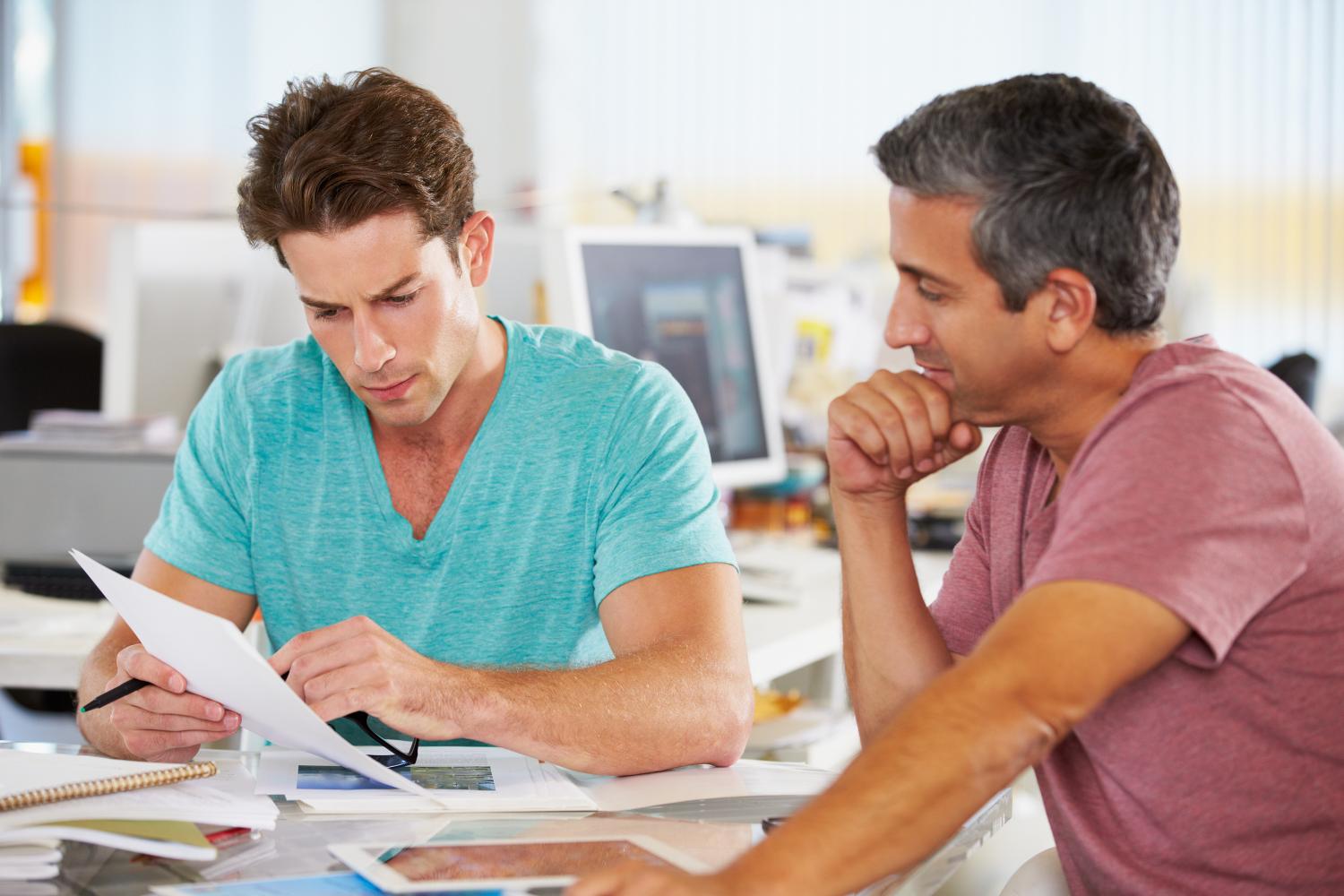 Photo of two men at table 