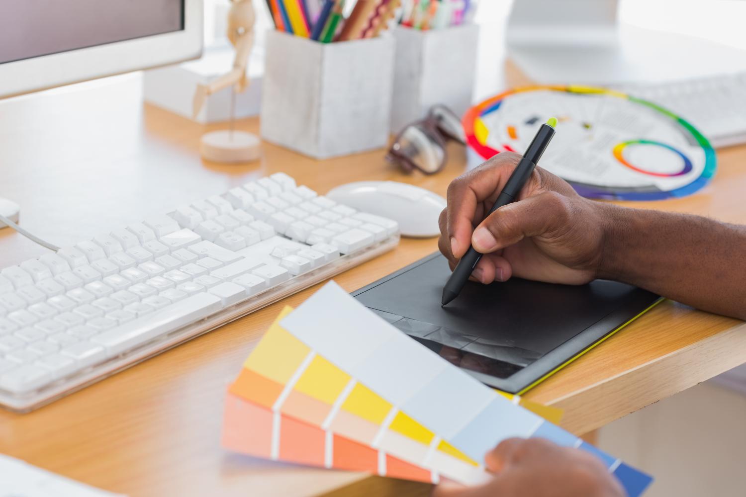 Photo of man holding color samples